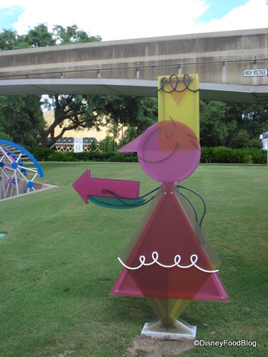 Pointing to the Festival Center at the Wonders of Life Pavilion