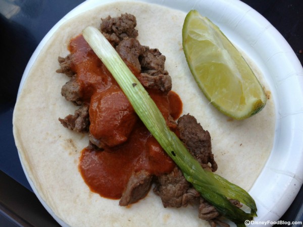 Taco de Filete with Cascabel Pepper Sauce and Scallions Served on a Flour Tortilla