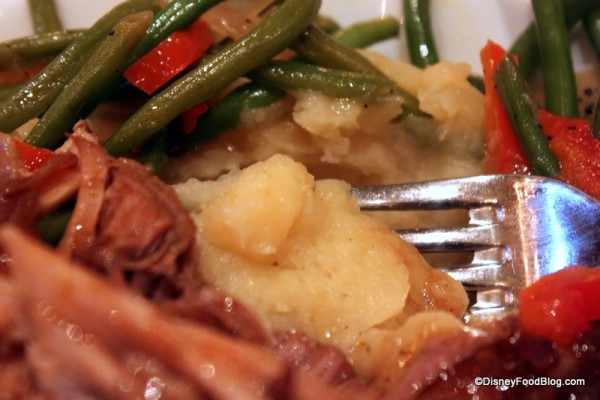 close up of mashed potatoes in braised pork Be Our Guest