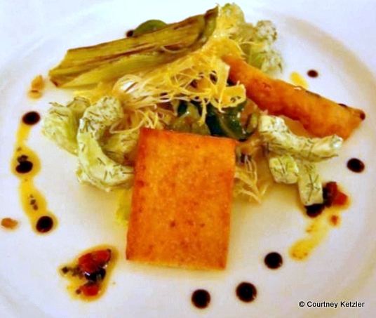 Seared leek, parmesan crisp, and cucumber dill frisee salad