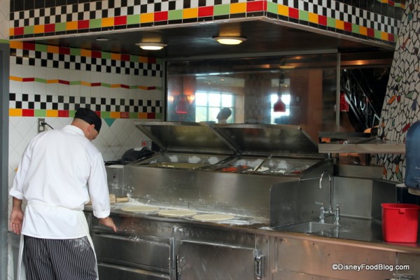 Wolfgang Puck Express making pizzas