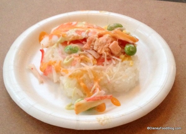 Chirashi Hanazushi (Grilled Salmon, cooked shrimp and crab stick served over a bed of fragrant ginger rice with Volcano and Dynamite sauce)