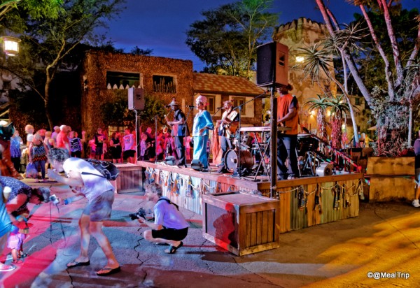 Band Plays While Guests Pose with Performers for Photos