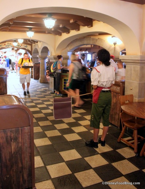 Cast Member holding "Reserved" sign