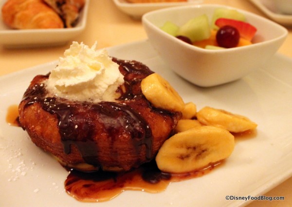 Croissant Doughnut topped with banana caramel sauce, pastry creme, and chocolate ganache