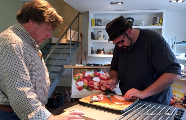 Aaron Getting Tips from John Cook on Filleting Fish