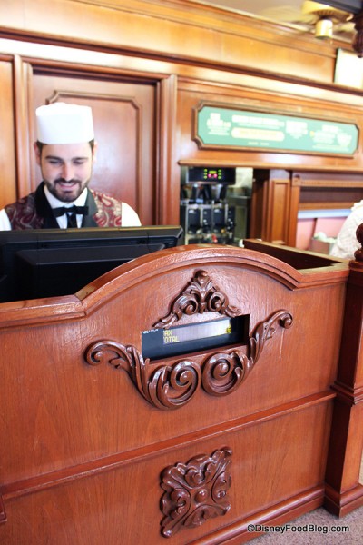 Crew member at the cash register.