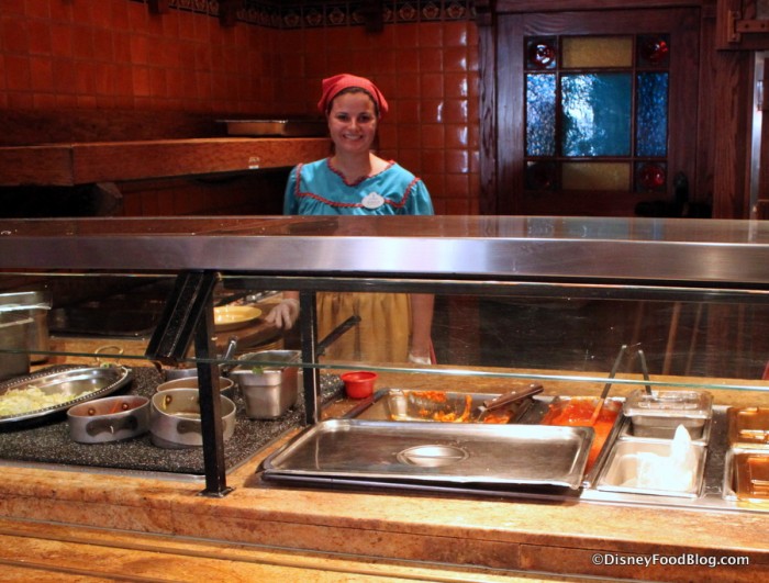 Disneyland Rancho del Zocalo_15_-Smiling cast member -- shows cafeteria like set up