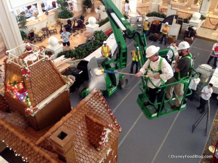 Putting the "snow" on the gingerbread house at Grand Floridian