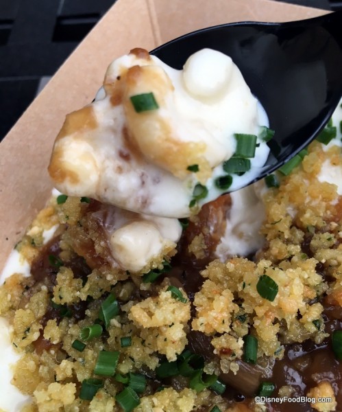 French onion mac and cheese topped with parmesan crumble and chives