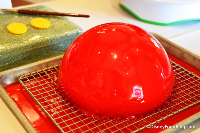 Another layer of glaze on cake